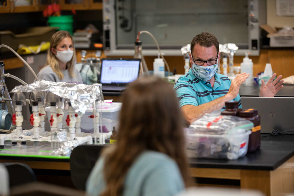 Professor Kyle Zimmer teaches an Environmental Studies class in Owens Science Hall in St. Paul on July 14, 2020. Professors and students across campus adopted masks and distancing in order to continue in-person learning. Mark Brown/University of St. Thomas