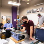 Students in Dr. Travis Welt’s Soil Mechanics and Foundations lab wear masks while working together. Liam James Doyle/University of St. Thomas