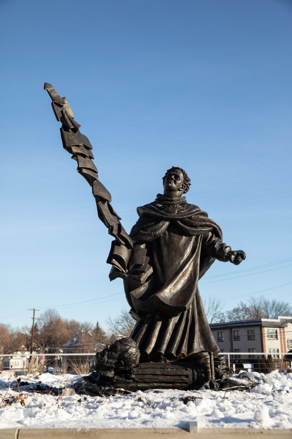 The 900-pound sculpture commands its site on O’Neill Terrace of the Iversen Center for Faith. The new sculpture of St. Thomas Aquinas is by Canadian artist Timothy P. Schmalz. Mark Brown/University of St. Thomas