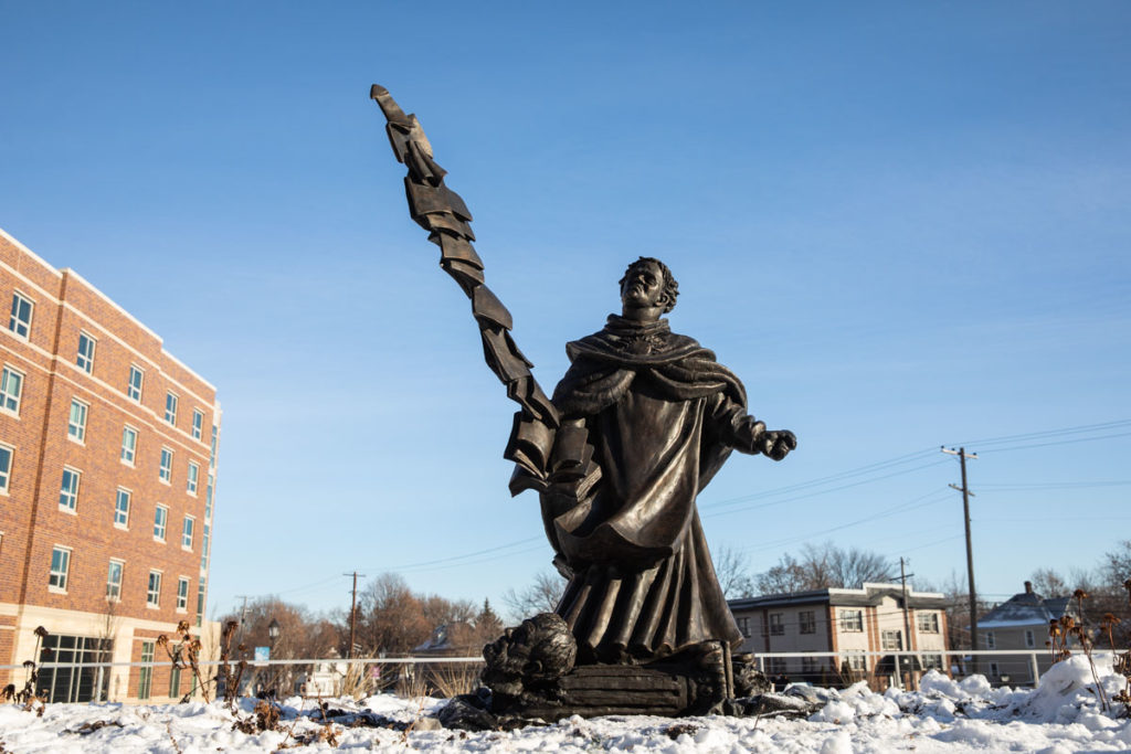 The 900-pound sculpture of St. Thomas Aquinas commands its site on O’Neill Terrace of the Iversen Center for Faith. Mark Brown/University of St. Thomas