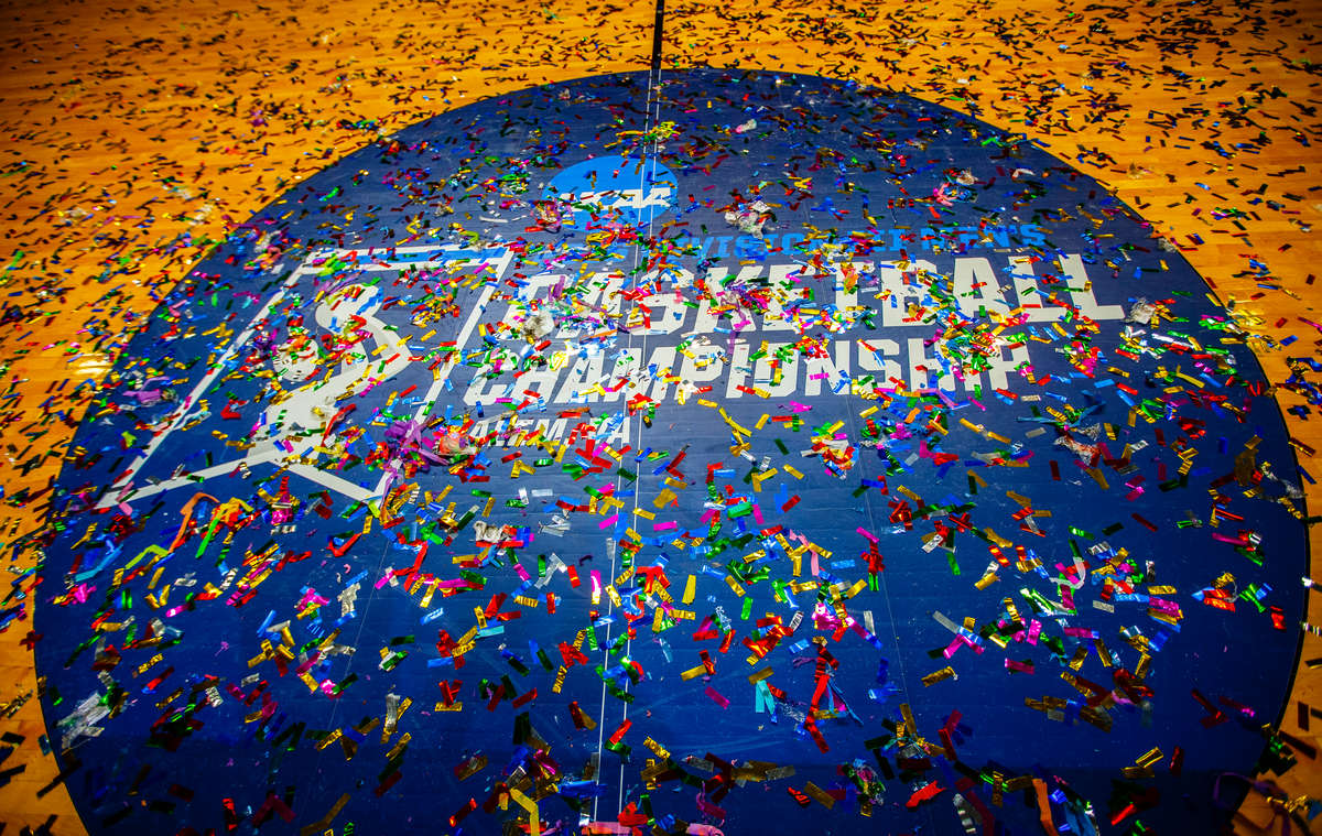 The NCAA logo and basketball championship logo are shown covered in confetti following the NCAA Division III men's basketball championship game March 19, 2016 at the Salem Civic Center in Salem, Va. The University of St. Thomas Tommies defeated the Benedictine University Eagles by a final score of 82-76.