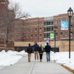 A Tommie Ambassador guides a family through campus. Mark Brown/University of St. Thomas