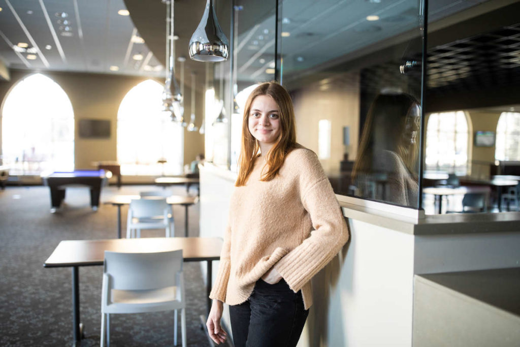 Gabrielle Koehne, senior and Chapter Vice President of the Delta Epsilon Sigma Honor Society, poses for a portrait in Scooters in the Anderson Student Center on March 4, 2021.