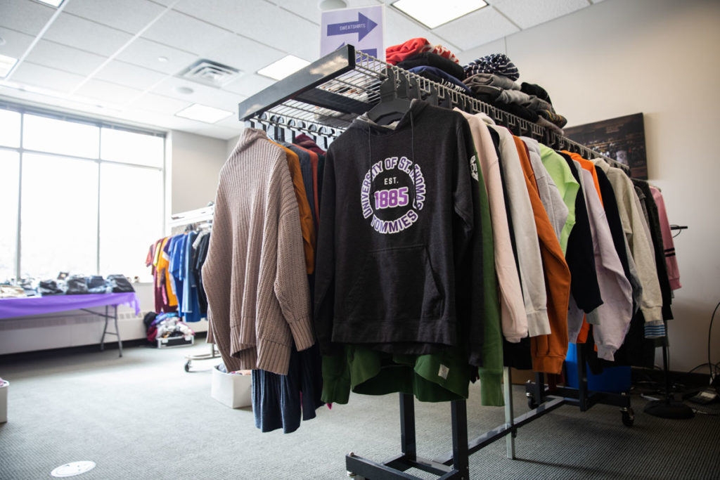Donated clothes on racks at Tommie's Closet. Mark Brown/University of St. Thomas