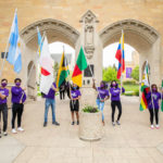 International Freshman students pose with their respective country’s flags.
