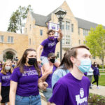 Freshman students March through the Arches.
