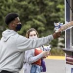 Students get food from food trucks during Tommie Fest. Mark Brown/University of St. Thomas