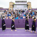 Students from the School of Law’s Class of 2020 walk into O’Shaughnessy Stadium at the beginning of their Commencement ceremony. Liam James Doyle/University of St. Thomas