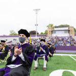 Students from the School of Law’s Class of 2020 sit socially distanced at O’Shaughnessy Stadium during their Commencement ceremony. Liam James Doyle/University of St. Thomas
