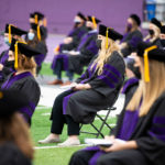 Students from the School of Law’s Class of 2020 sit socially distanced at O’Shaughnessy Stadium during their Commencement ceremony. Liam James Doyle/University of St. Thomas