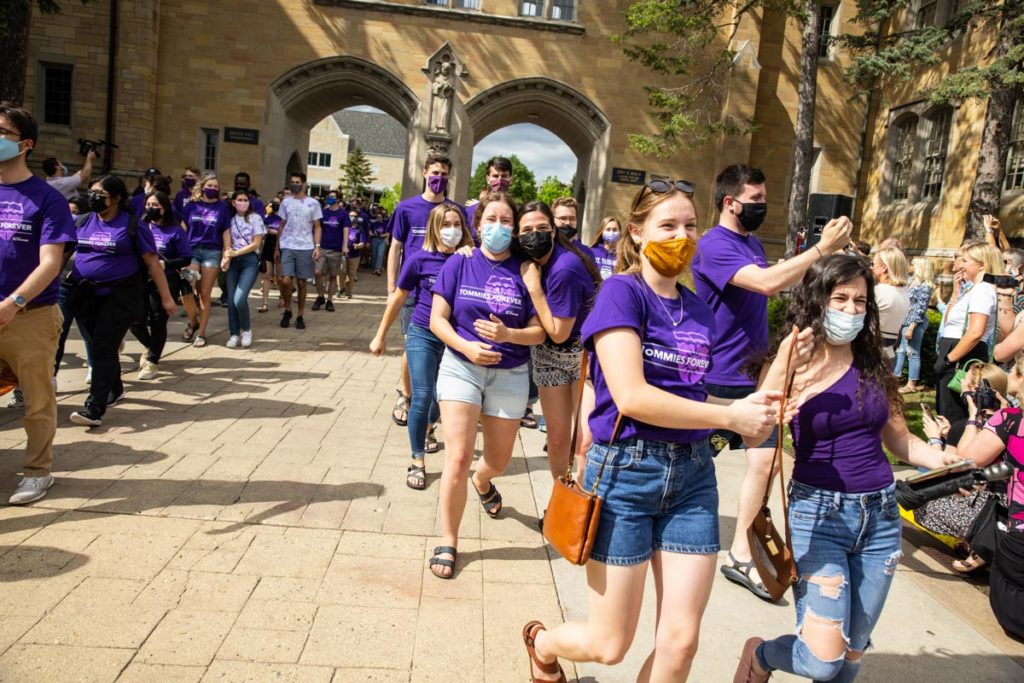 Students walk toward Summit Avenue during the annual March Out of the Arches event. Mark Brown/University of St. Thomas