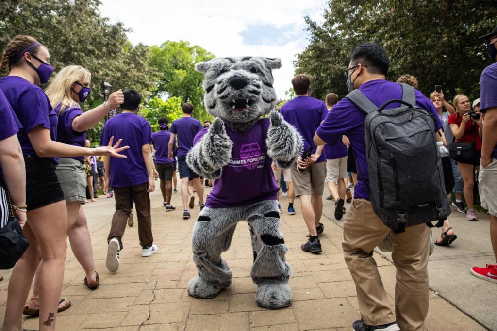 Tommie greets students during the annual March Out of the Arches event. Mark Brown/University of St. Thomas