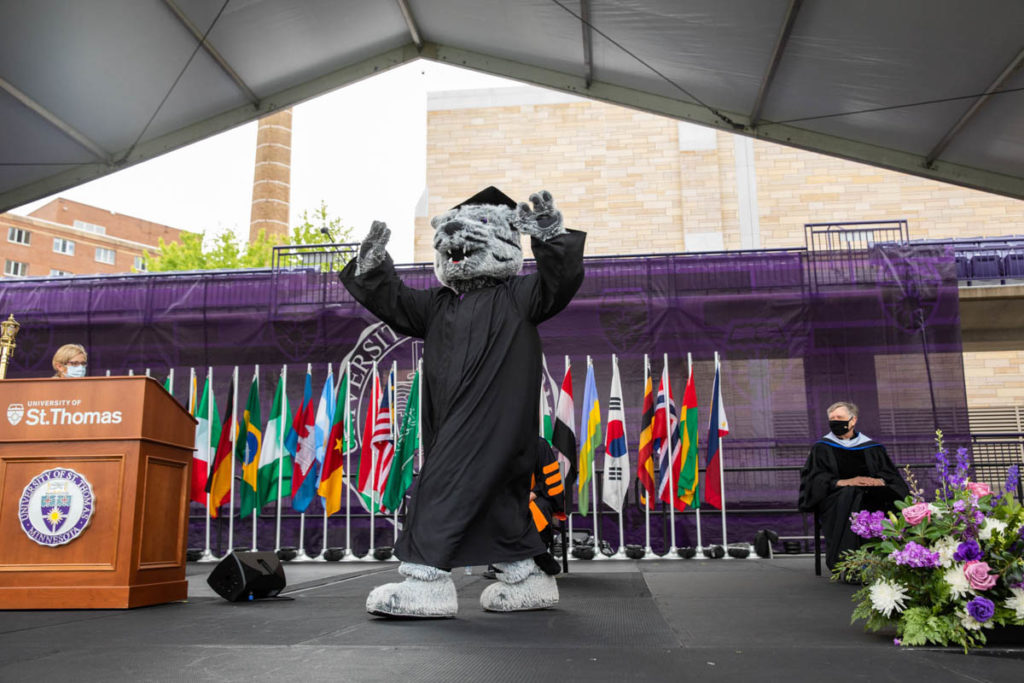 Tommie the mascot walks across stage. Mark Brown/University of St. Thomas