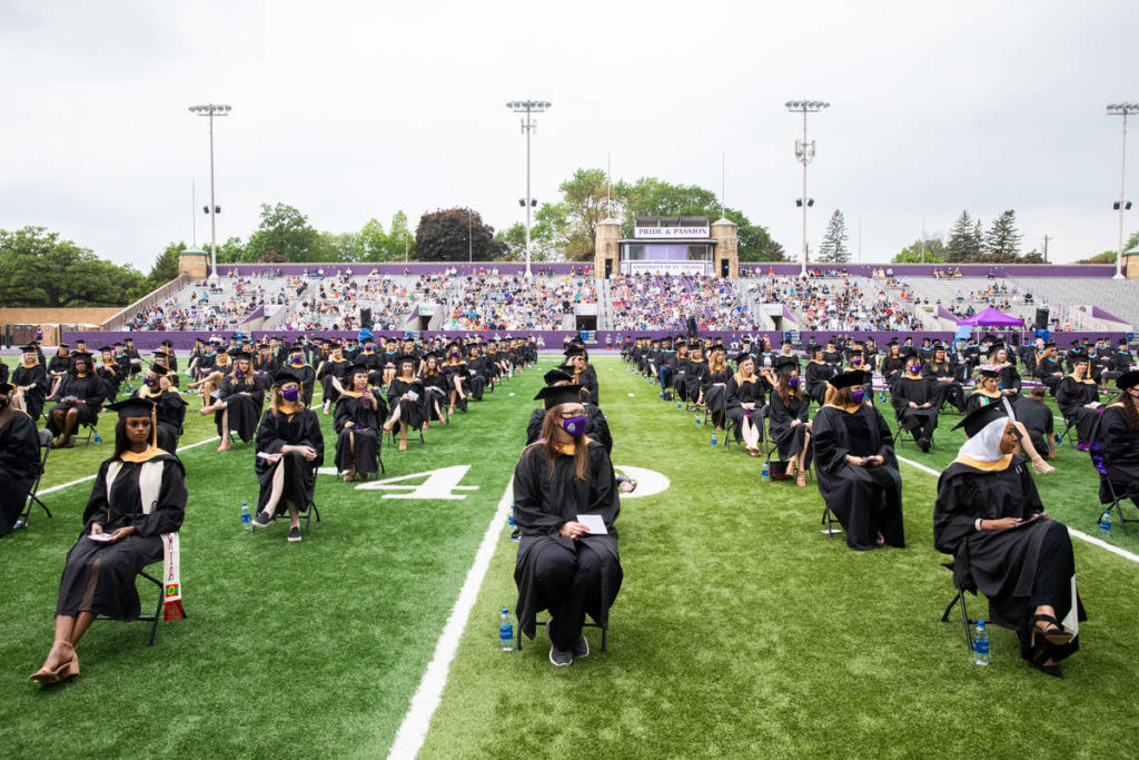 Students attend the graduate commencement ceremony. Liam James Doyle/University of St. Thomas