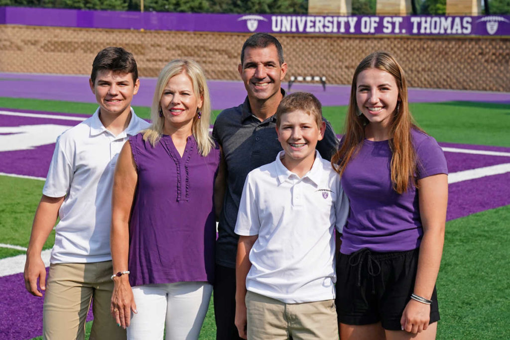 Family photo of head football coach Glenn Caruso with his wife Rachel, daughter Anna and sons Cade and Truman