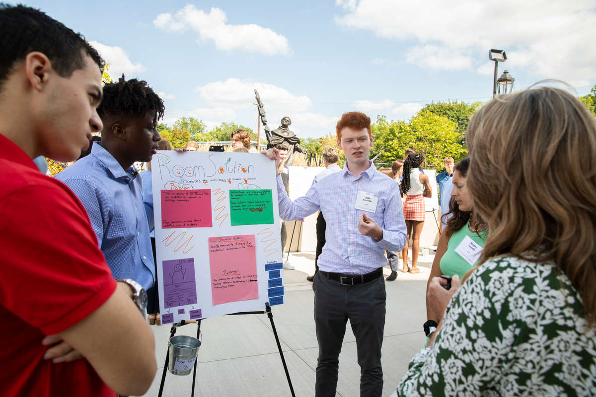 Freshman Entrepreneurship students present and pitch their original business concepts in groups to mentors during the Freshman Innovation Immersion session in the Iversen Center for Faith on September 1, 2021, in St. Paul.