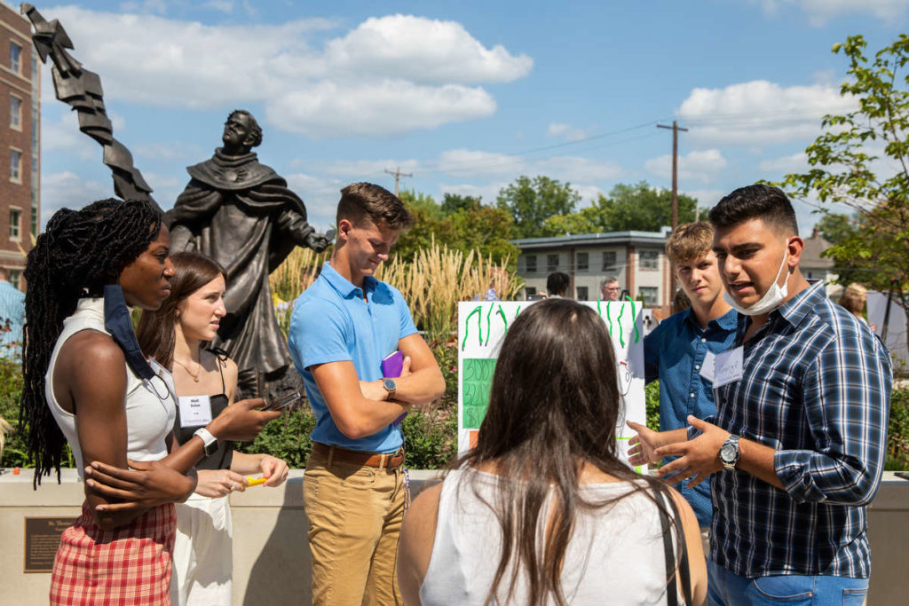 Freshman Entrepreneurship students present and pitch their original business concepts in groups to mentors during the Freshman Innovation Immersion session in the Iversen Center for Faith on September 1, 2021, in St. Paul.