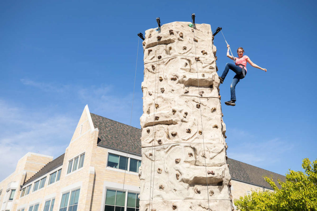 Students rock climb on the lower quad. Liam James Doyle/University of St. Thomas