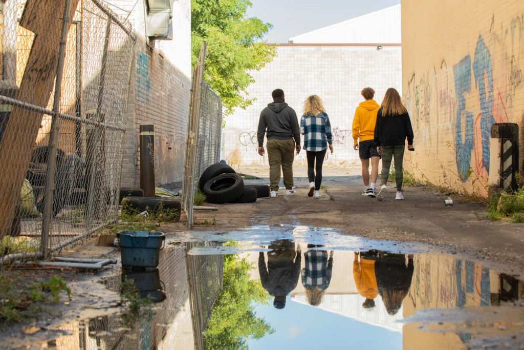Students in Professor Heather Shirey’s Art History class visit the site of the Minneapolis Police 3rd Precinct to observe and discuss the street art that has been made since the destructive protests that occurred there in May of 2020 following the murder of George Floyd. Liam James Doyle/University of St. Thomas