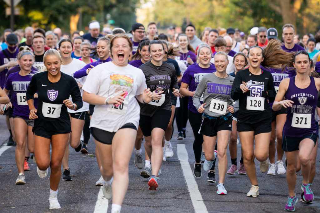 Runners take off at the start of the Wellness 5k. Liam James Doyle/University of St. Thomas