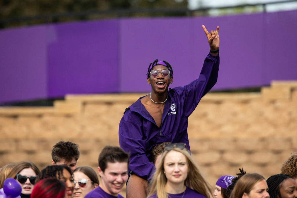 A student fan cheers during the Homecoming football game. Mark Brown/University of St. Thomas