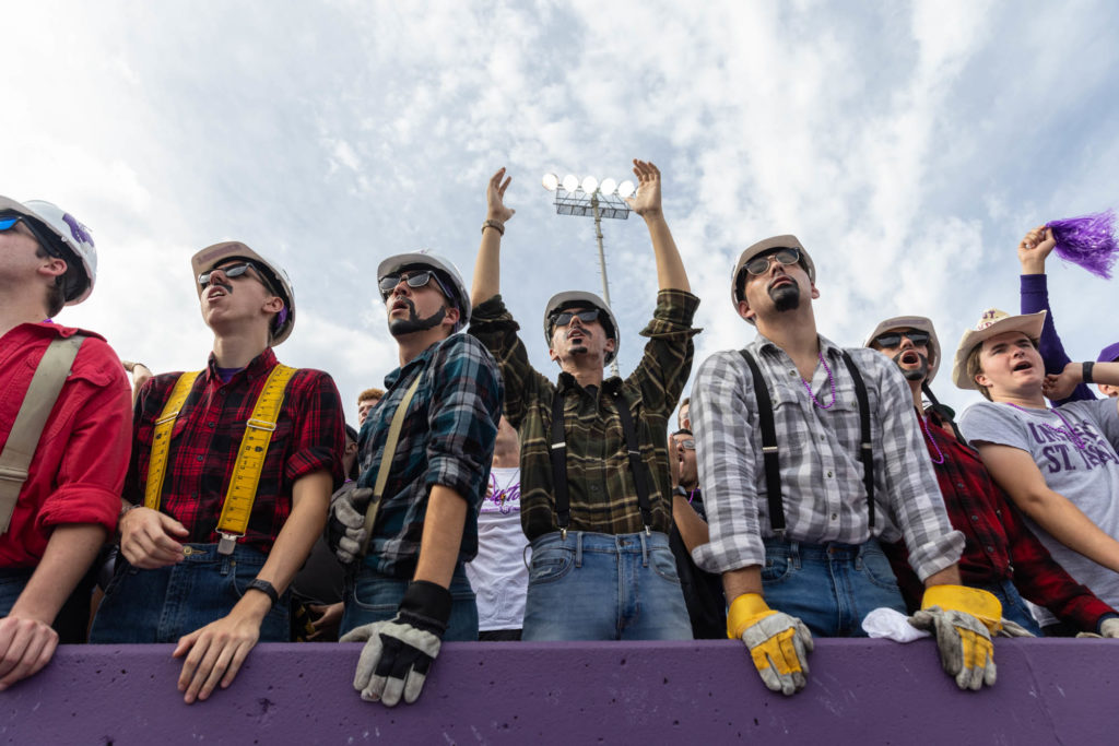 Caruso's Crew cheers during the Homecoming football game. Mark Brown/University of St. Thomas