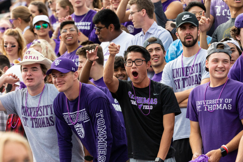 Fans cheer during the Homecoming football game. Mark Brown/University of St. Thomas