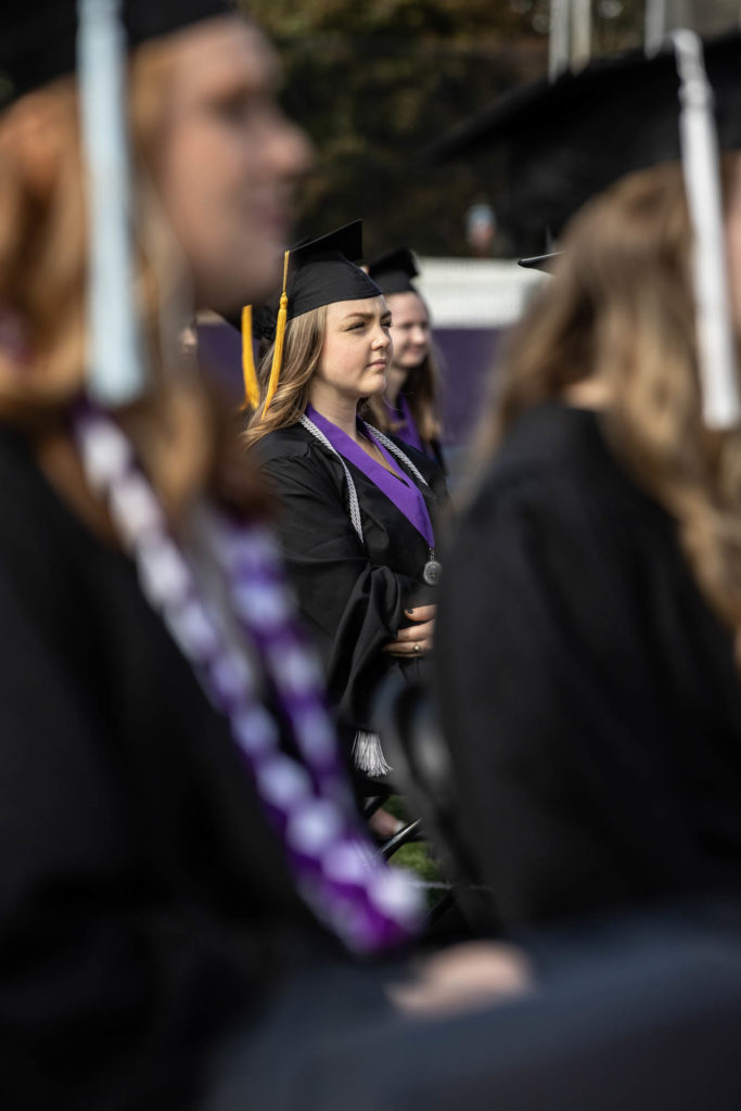Students listen to a speech during a commencement ceremony in O’Shaughnessy Stadium on October 10, 2021, in St. Paul. The graduation ceremony was finally celebrated after being canceled in 2020 due to the COVID-19 pandemic.
