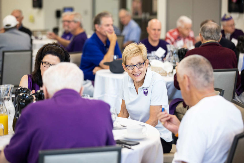 University President Julie Sullivan socializes with alumni members of the University of St. Thomas’ Old Guard who gathered for a 50-Year Reunion event during Homecoming weekend. Liam James Doyle/University of St. Thomas