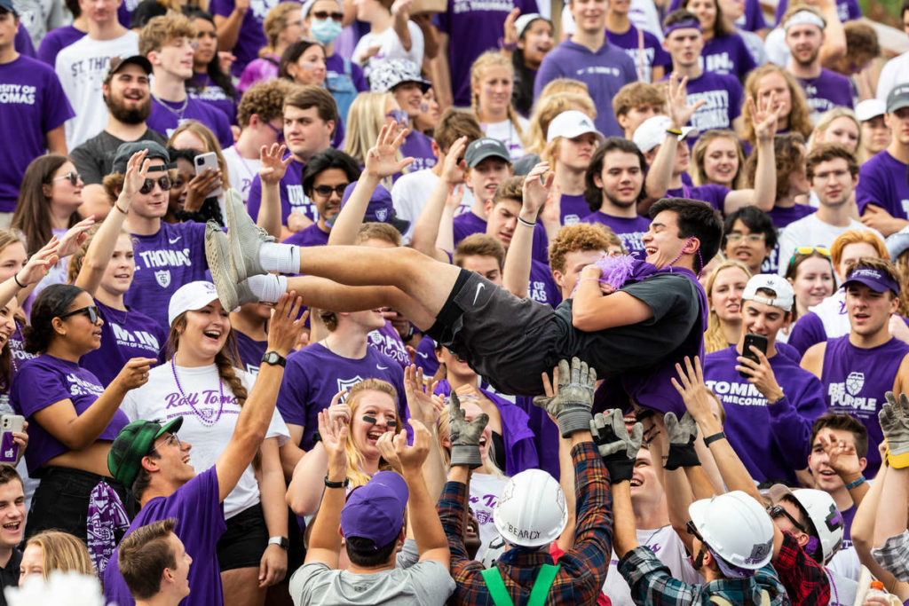 Caruso’s Crew tosses a fan in the air during the Homecoming Football game against Valparaiso. Mark Brown/University of St. Thomas