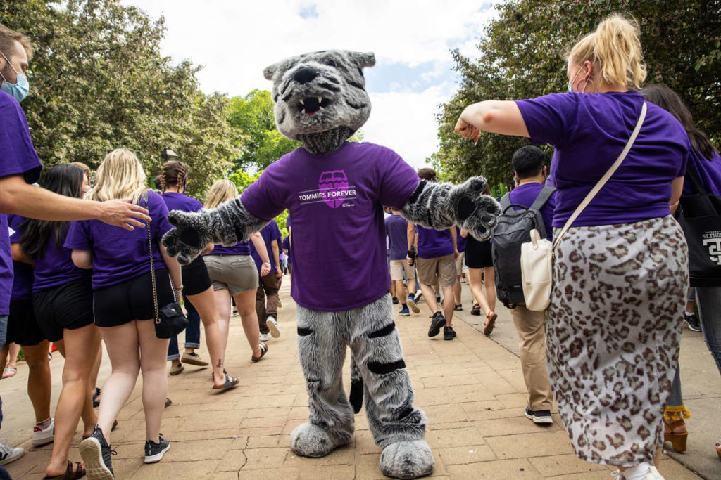 Tommie greets students during the annual March Out of the Arches tradition. Mark Brown/University of St. Thomas