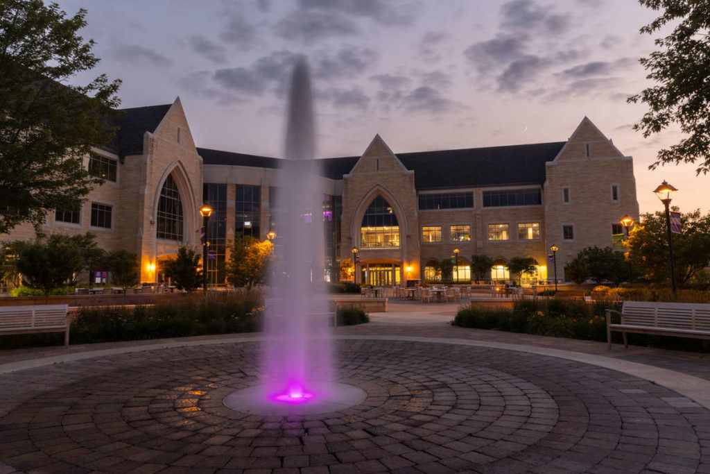 The Anderson Student Center and Harpole Fountain and Monahan Plaza at dusk in July. Mark Brown/University of St. Thomas