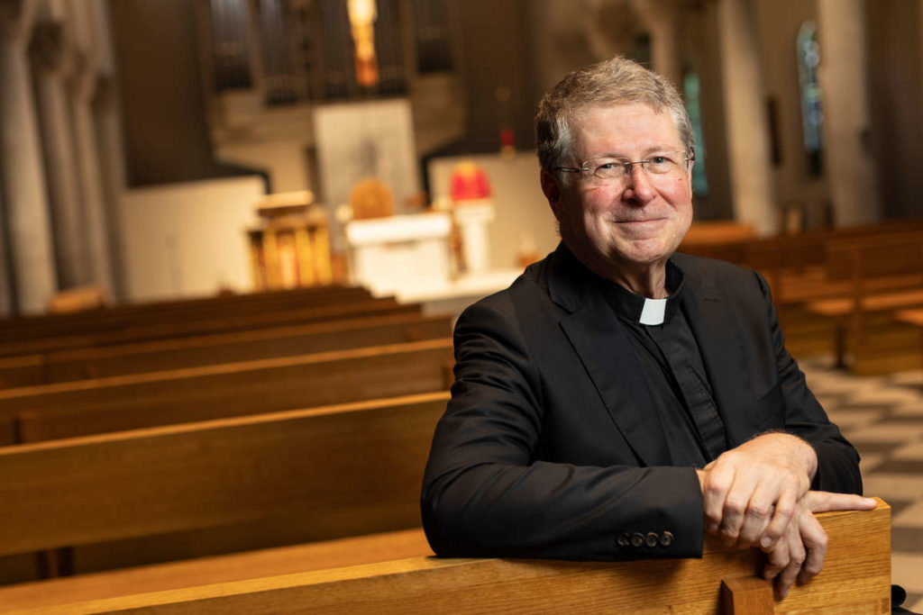 Father Jan Michael Joncas poses for portraits in St. Mary’s Chapel in St. Paul.  Mark Brown/University of St. Thomas