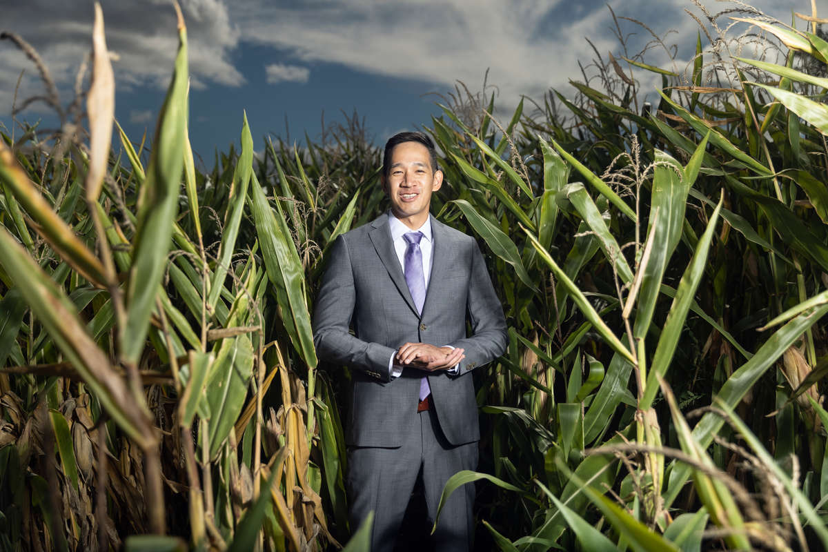 School of Law alum Hiep Pham ’12, Senior Intellectual Property Counsel for Cargill, poses for a photo in a cornfield west of the Twin Cities. Mark Brown/University of St. Thomas