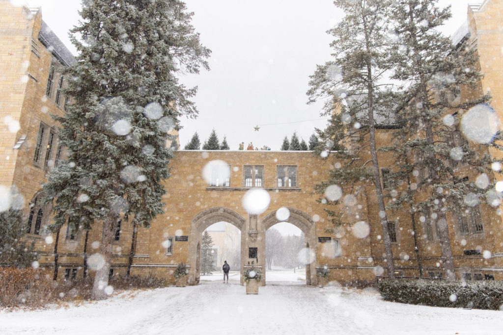 Snow flurries in front of The Arches. Liam James Doyle/University of St. Thomas