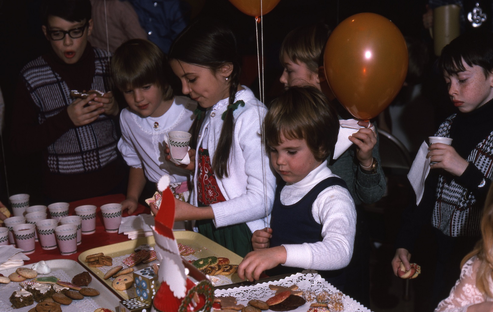 Children at cookie table in 1975.