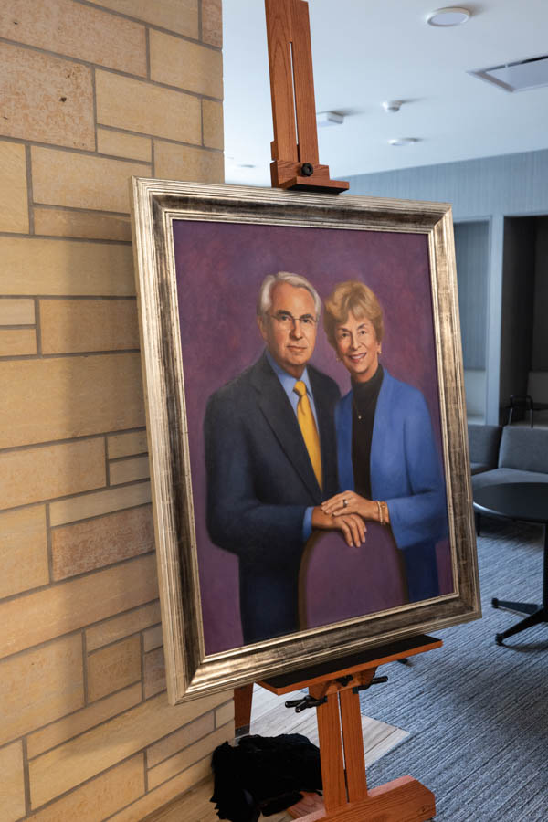 A new portrait of Mary and Gene Frey is unveiled during an event celebrating the Frey Room and Board Grants gift in  the newly renamed Mary and Gene Frey Hall (formerly Tommie East) on May 11, 2022 in St. Paul.