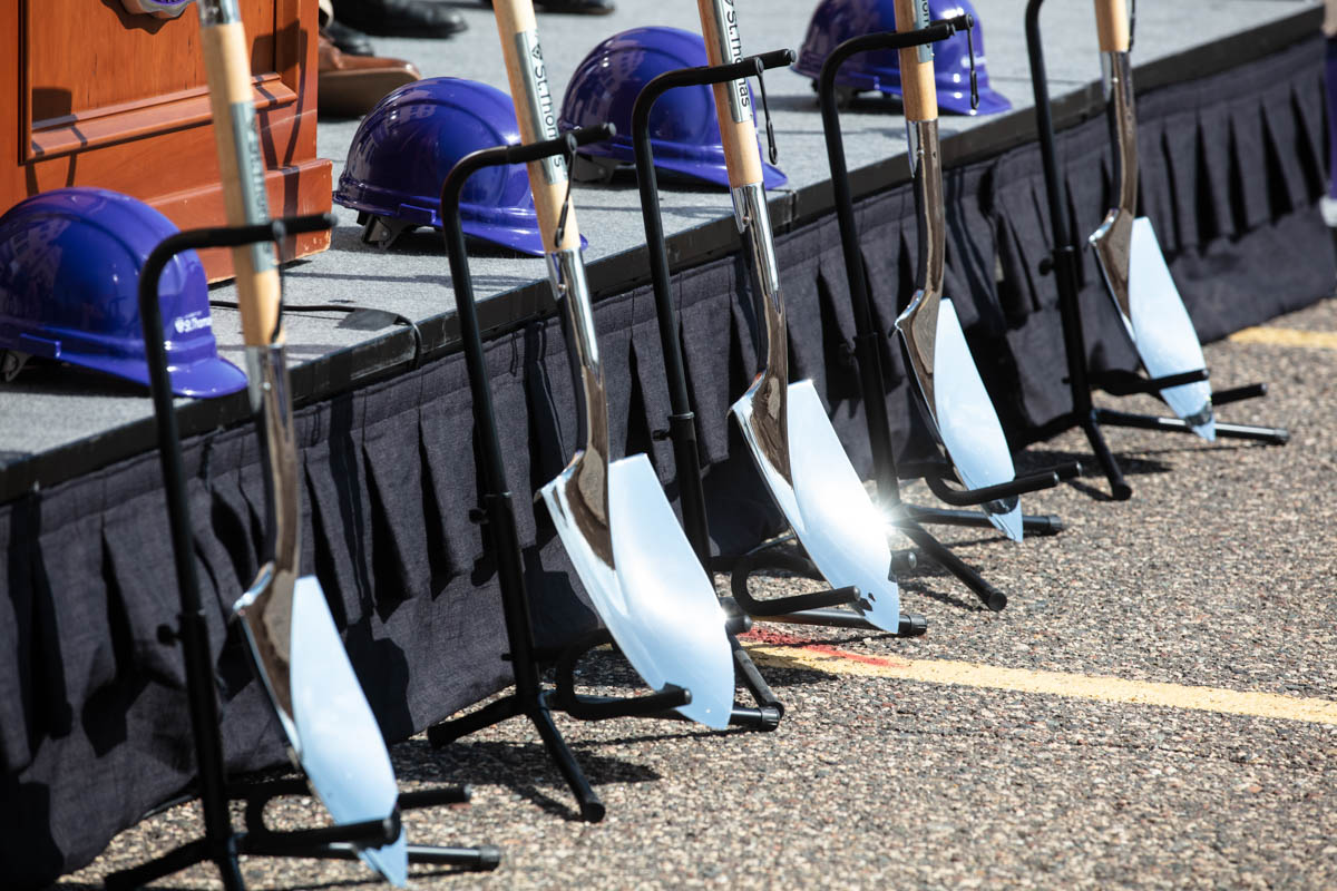 Shovels stand in a rack during a groundbreaking ceremony for the Schoenecker Center on May 12, 2022, in St. Paul in the parking lot where the new building will be located on south campus.