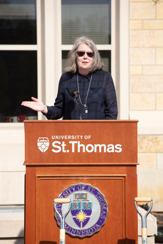 Lisa Anderson speaks during a groundbreaking ceremony for the Schoenecker Center on May 12, 2022, in St. Paul in the parking lot where the new building will be located on south campus.
