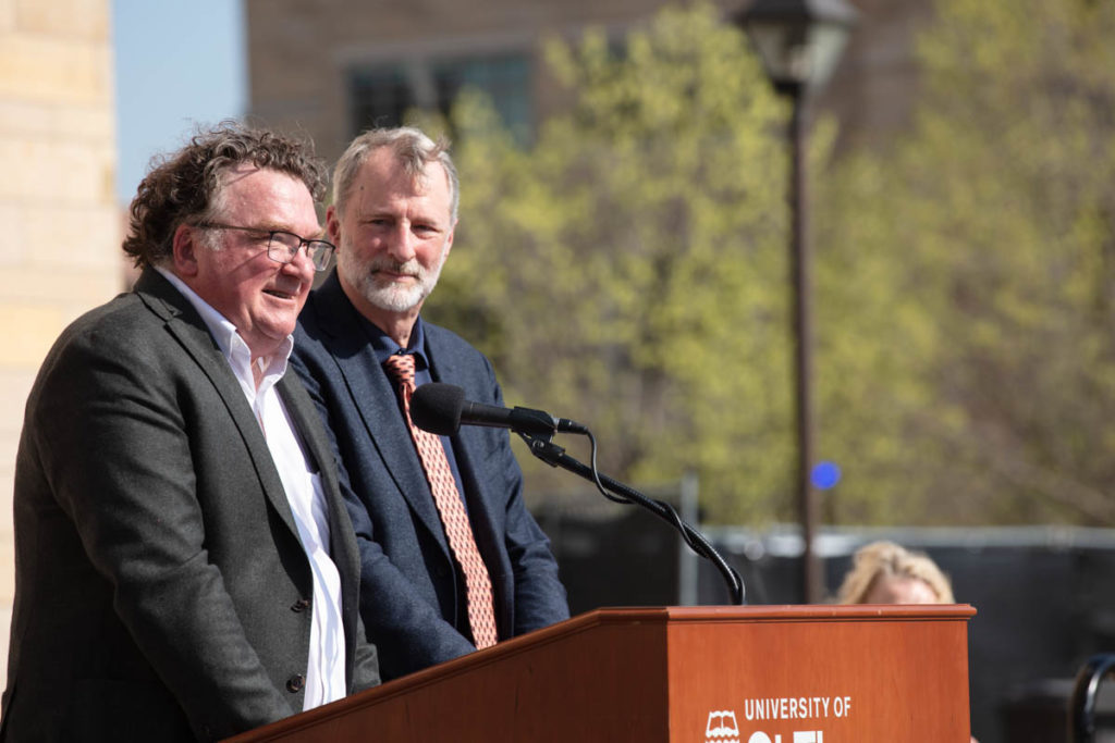 School of Engineering Dean Don Weinkauf and College of Liberal Arts Interim Dean Mark Stansbury-O’Donnell speak during a groundbreaking ceremony for the Schoenecker Center on May 12, 2022, in St. Paul in the parking lot where the new building will be located on south campus.