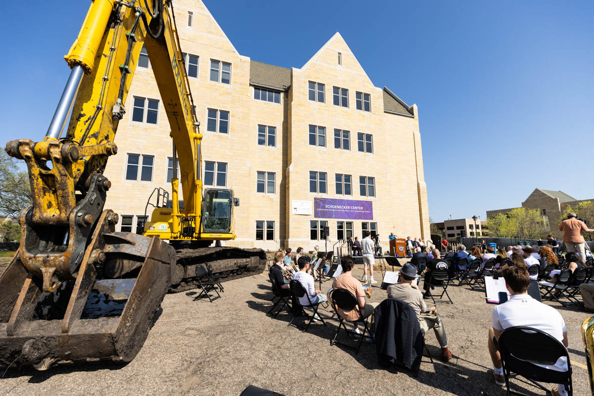 Guests attend a groundbreaking ceremony for the Schoenecker Center.