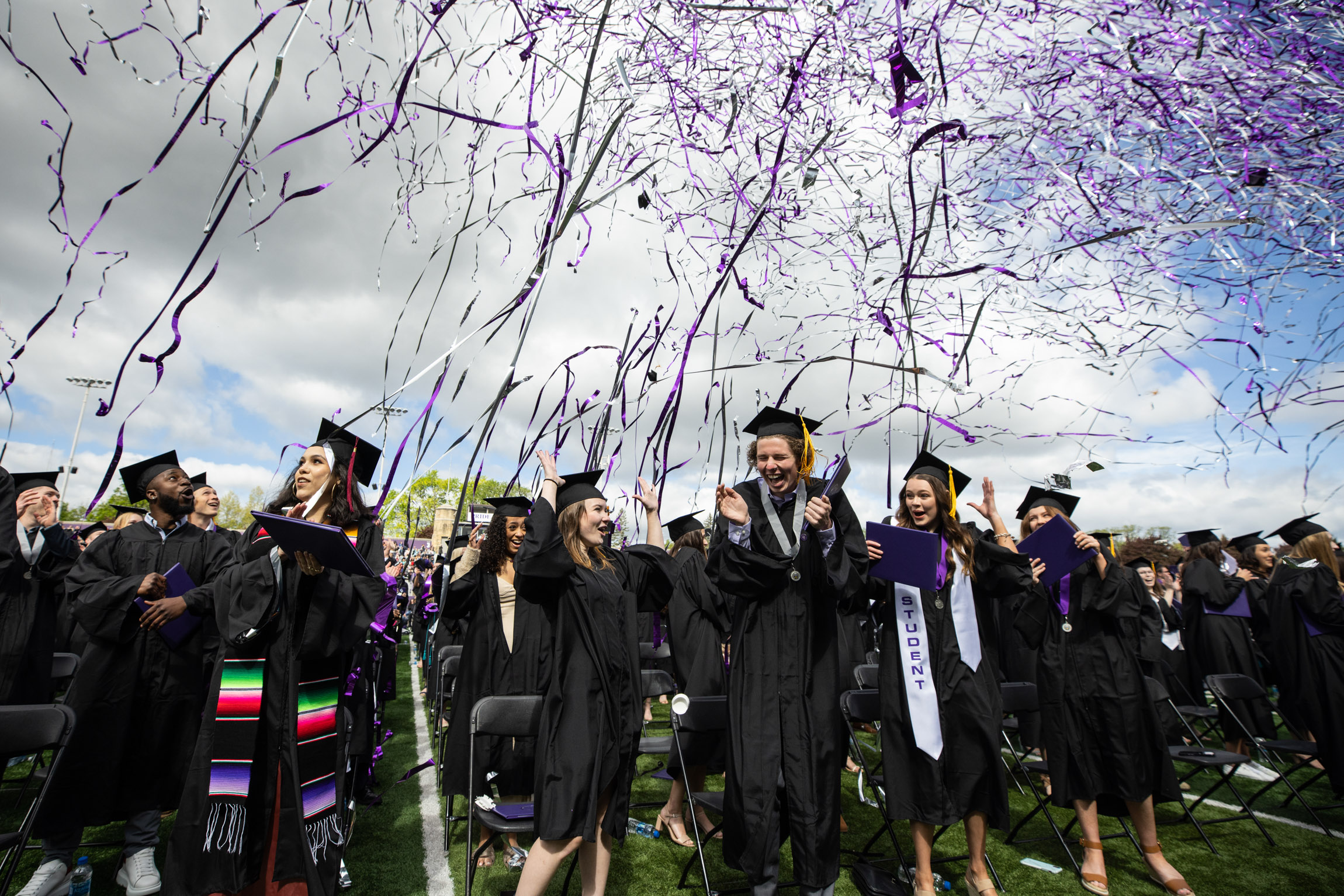 Graduates celebrate as confetti flies during the 2022 Undergraduate Commencement Ceremony for the College of Arts and Sciences on May 21, 2022, in St. Paul.