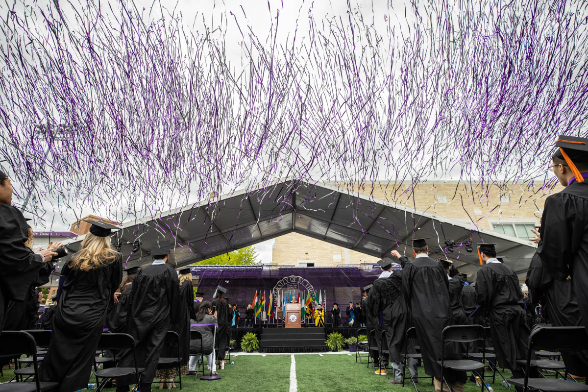 Confetti flies during the 2022 Undergraduate Commencement Ceremony for the Morrison Family College of Health, the School of Education and the School of Engineering on May 21, 2022, in St. Paul.