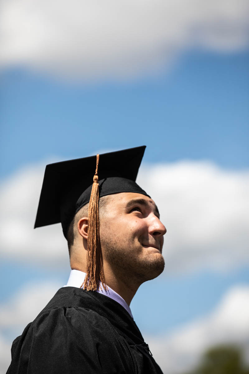 A student soaks in the moment during the 2022 Undergraduate Commencement Ceremony for the Opus College of Business on May 21, 2022, in St. Paul.