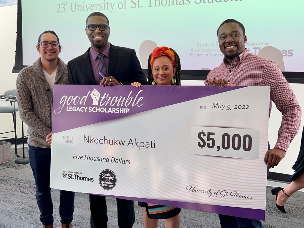Nkechukw Akpati with Scholarship Check