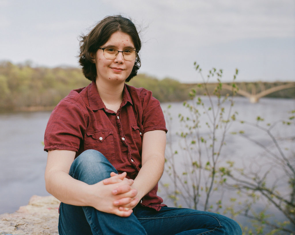 Victoria Kurdyumov, a First-Year studying Neuroscience, poses for a portrait alongside the Mississippi River on May 10, 2022, in St. Paul.