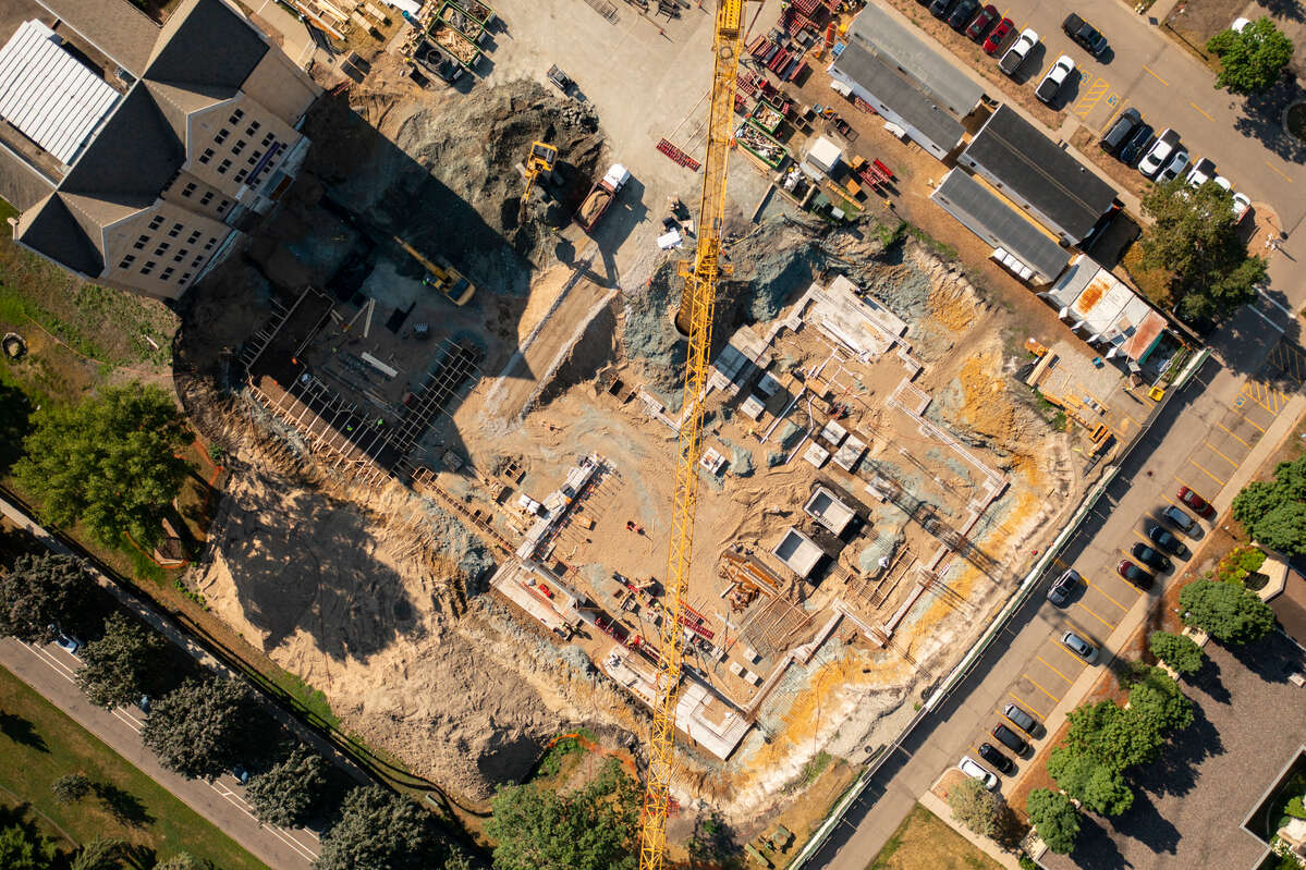 An aerial photo of construction crews working on the Schoenecker Center on south campus. Mark Brown/University of St. Thomas