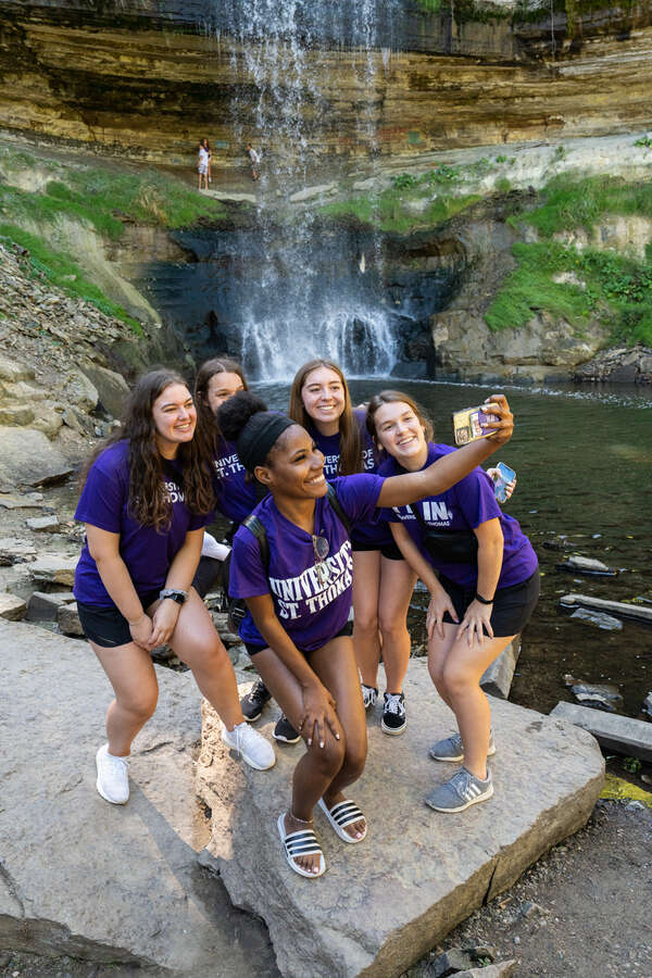 Students gather on a Welcome Days field trip to Minnehaha Falls waterfall in Minneapolis. Mark Brown/University of St. Thomas