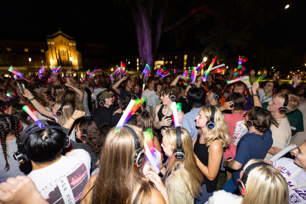 Students dance and celebrate during Headphone Disco on the upper quad on September 4, 2022, in St. Paul.