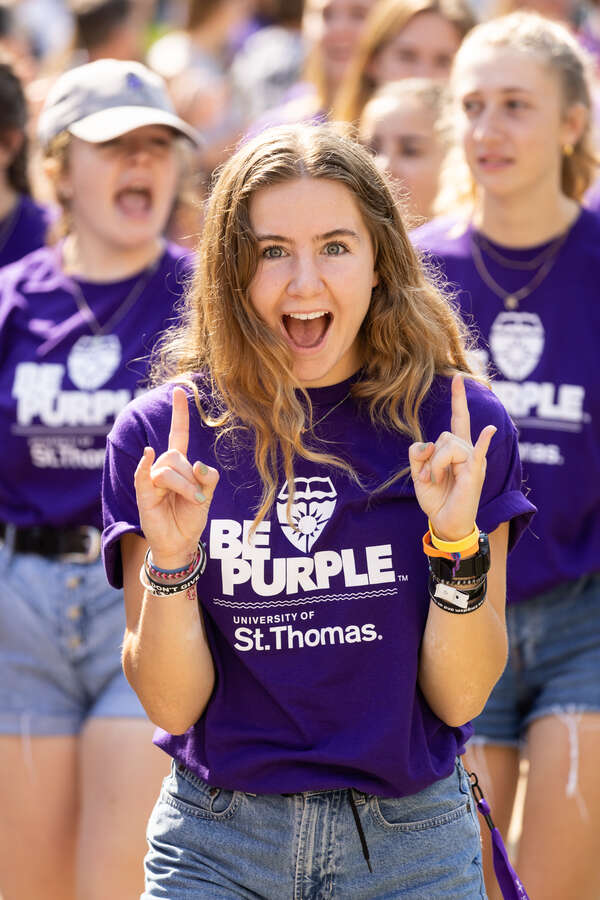 A student celebrates during March Through the Arches for the Class of 2026. Mark Brown/University of St. Thomas